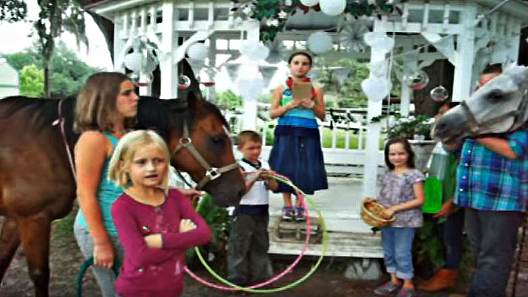 Wedding ceremony with children and horses