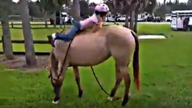 Second child mounting with horse's help
